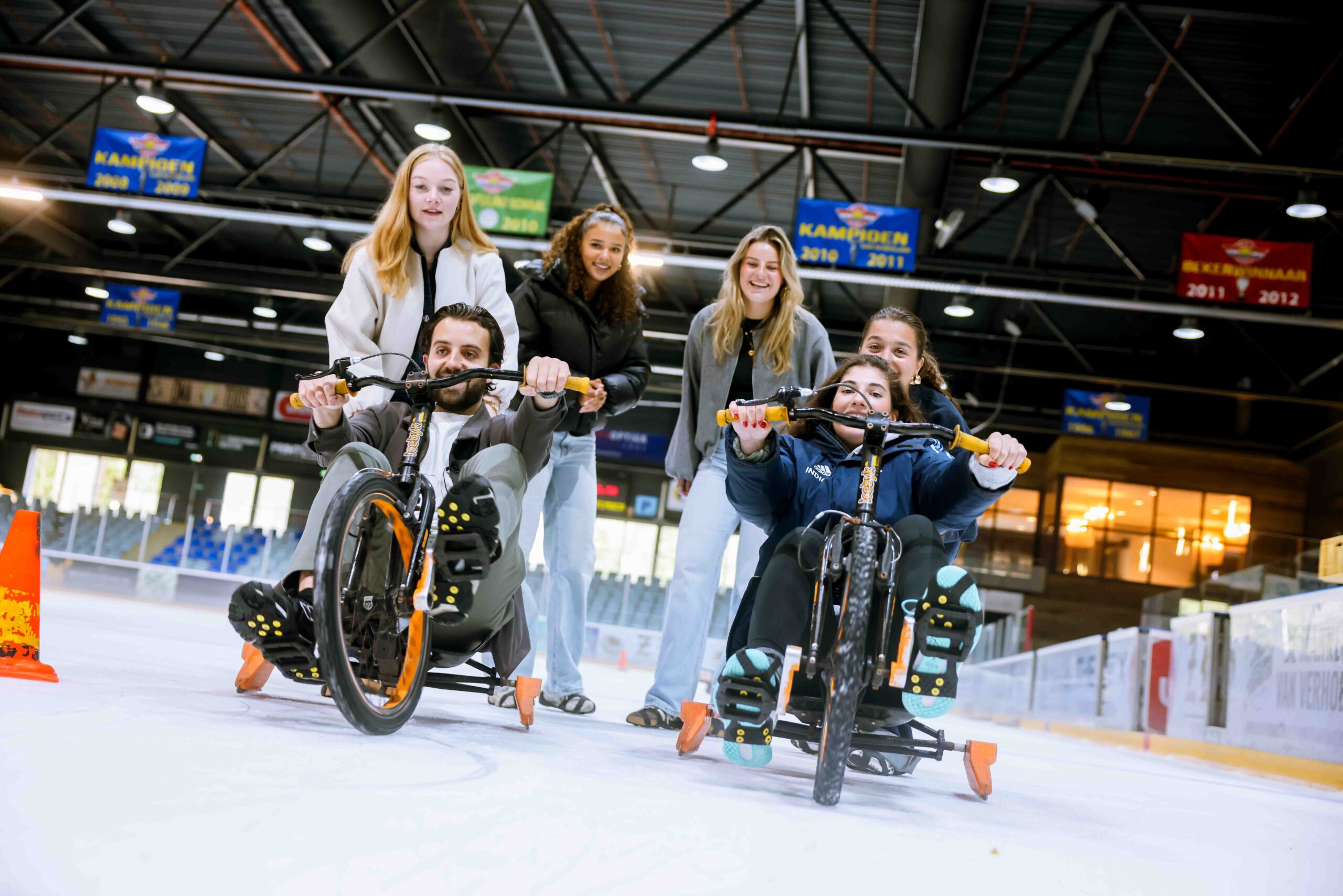 Group of people on ice bikes.